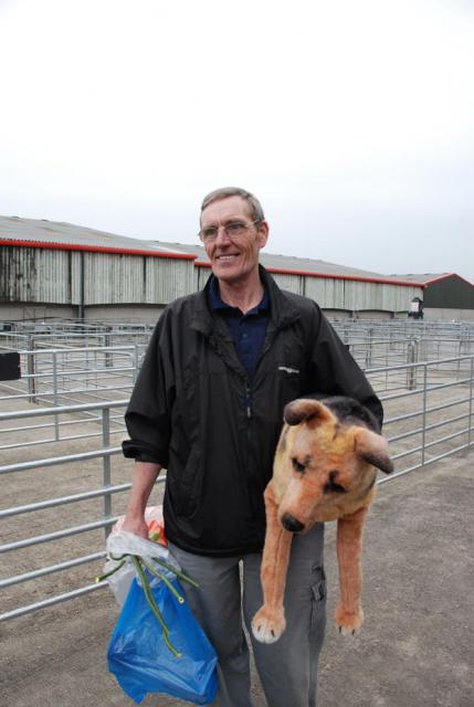 man carries dog