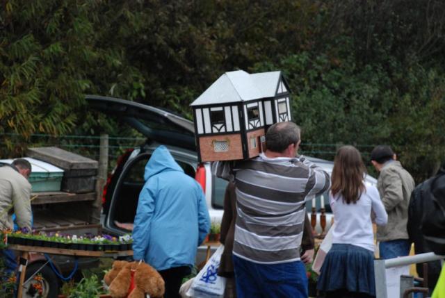 man carrying house